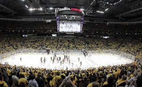 Apr 23, 2016; Pittsburgh, PA, USA; The Pittsburgh Penguins react at center ice after defeating the New York Rangers in game five of the first round of the 2016 Stanley Cup Playoffs at the CONSOL Energy Center. The Penguins won 6-3 to take the series 4 games to 1. Mandatory Credit: Charles LeClaire-USA TODAY Sports