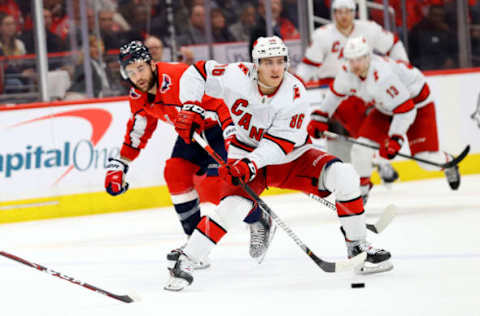 WASHINGTON, DC – JANUARY 13: Teuvo Teravainen #86 of the Carolina Hurricanes skates with the puck in front of Tom Wilson #43 of the Washington Capitals in the third period at Capital One Arena on January 13, 2020, in Washington, DC. (Photo by Rob Carr/Getty Images)