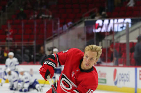 RALEIGH, NC – SEPTEMBER 18: Carolina Hurricanes center Ryan Dzingel (18) with the puck during the warmups of the Carolina Hurricanes game versus the Tampa Bay Lightning on September 18th, 2019 at PNC Arena in Raleigh, NC. (Photo by Jaylynn Nash/Icon Sportswire via Getty Images)