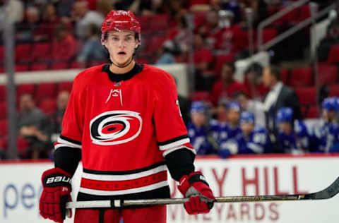 Sep 20, 2017; Raleigh, NC, USA; Carolina Hurricanes defensemen Jake Bean (24) gets ready for a face off against the Tampa Bay Lightning at PNC Arena. The Tampa Bay Lightning defeated the Carolina Hurricanes 4-3. Mandatory Credit: James Guillory-USA TODAY Sports