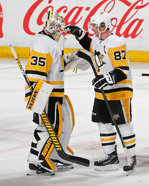 Sidney Crosby #87 and Tristan Jarry #35 of the Pittsburgh Penguins. (Photo by Joel Auerbach/Getty Images)