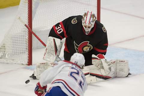 Feb 26, 2022; Ottawa, Ontario, CAN; Montreal Canadiens right wing Cole Caufield (22) shoots on Ottawa Senators goalie Matt Murray (22) in the third period at the Canadian Tire Centre. Mandatory Credit: Marc DesRosiers-USA TODAY Sports