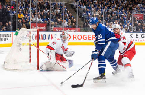 TORONTO, ON – DECEMBER 23: John Tavares #91 of the Toronto Maple Leafs goes to the net against Jaccob Slavin #74 of the Carolina Hurricanes during the first period at the Scotiabank Arena on December 23, 2019 in Toronto, Ontario, Canada. (Photo by Mark Blinch/NHLI via Getty Images)