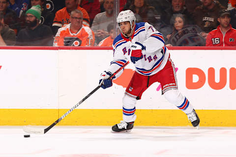 PHILADELPHIA, PA – DECEMBER 23: Tony DeAngelo #77 of the New York Rangers passes the puck against the Philadelphia Flyers at the Wells Fargo Center on December 23, 2019 in Philadelphia, Pennsylvania. (Photo by Mitchell Leff/Getty Images)