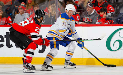 NEWARK, NEW JERSEY – OCTOBER 23: Victor Olofsson #71 of the Buffalo Sabres in action against Damon Severson #28 of the New Jersey Devils at Prudential Center on October 23, 2021 in Newark, New Jersey. The Devils defeated the Sabres 2-1 in overtime. (Photo by Jim McIsaac/Getty Images)