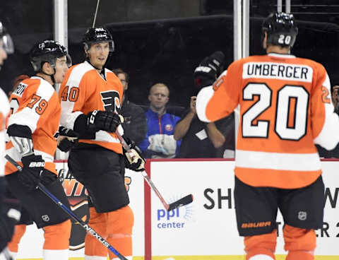 Sep 21, 2015; Philadelphia, PA, USA; Philadelphia Flyers center Vincent Lecavalier (40) celebrates his goal with defenseman Ivan Provorov (79) and left wing R.J. Umberger (20) against the New York Islanders during the second period at PPL Center. Mandatory Credit: Eric Hartline-USA TODAY Sports