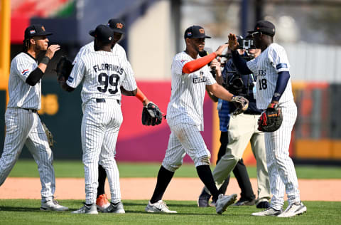 Didi Gregorius  (18),Xander Bogaerts, and Wendell Floranus (99) of Team Netherlands celebrate during the World Baseball Classic Pool A game between Panama and Netherlands at Taichung Intercontinental Baseball Stadium in Taichung, Taiwan. (Photo by Gene Wang/Getty Images)