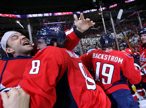 Washington Capitals goalie Olaf Kolzig and Washington Capitals left wing Alexander Ovechkin celebrate after defeating the Florida Panthers to clinch the Southeast Division title on April 5, 2008.