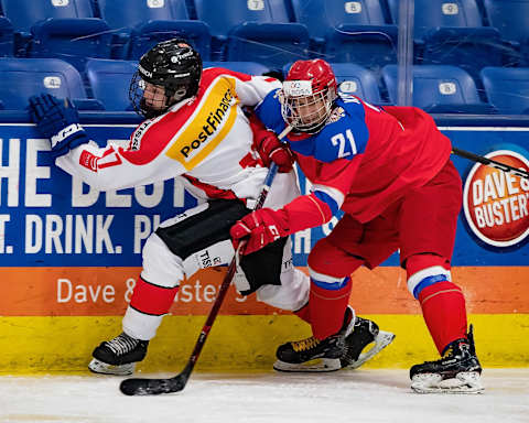 PLYMOUTH, MI – DECEMBER 11: Kevin Lindemann #17 of the Switzerland Nationals battles along the boards with Alexandr Kisakov #21 of the U17 Russian Nationals during day one of game one of the 2018 Under-17 Four Nations Tournament at USA Hockey Arena on December 11, 2018 in Plymouth, Michigan. Russia defeated Switzerland 9-1. (Photo by Dave Reginek/Getty Images)