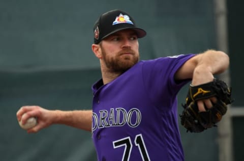 SCOTTSDALE, CO – FEBRUARY 19: Colorado Rockies pitcher Wade Davis (71) delivers a pitch during the teams workout on February 19, 2018 at Salt River Fields at Talking Stick in Scottsdale, Arizona. (Photo by John Leyba/The Denver Post via Getty Images)