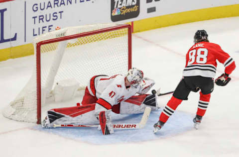 Feb 2, 2021; Chicago, Illinois, USA; Carolina Hurricanes goaltender James Reimer (47) defends a shot from Chicago Blackhawks right wing Patrick Kane (88) during a shoot-out at United Center. Mandatory Credit: Kamil Krzaczynski-USA TODAY Sports