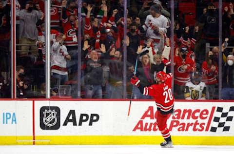 RALEIGH, NORTH CAROLINA – JANUARY 25: Sebastian Aho #20 of the Carolina Hurricanes celebrates scoring the game-winning goal during overtime of the game against the Vegas Golden Knights at PNC Arena on January 25, 2022, in Raleigh, North Carolina. (Photo by Jared C. Tilton/Getty Images)