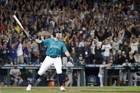 SEATTLE, WASHINGTON – SEPTEMBER 30: Cal Raleigh #29 of the Seattle Mariners celebrates his walk-off home run during the ninth inning against the Oakland Athletics at T-Mobile Park on September 30, 2022 in Seattle, Washington. With the win, the Seattle Mariners have clinched a postseason appearance for the first time in 21 years, the longest playoff drought in North American professional sports. (Photo by Steph Chambers/Getty Images)