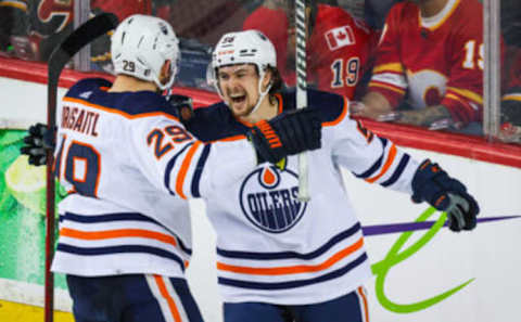 May 18, 2022; Calgary, Alberta, CAN; Edmonton Oilers right wing Kailer Yamamoto (56) celebrates his goal with center Leon Draisaitl (29) during the third period against the Calgary Flames in game one of the second round of the 2022 Stanley Cup Playoffs at Scotiabank Saddledome. Mandatory Credit: Sergei Belski-USA TODAY Sports