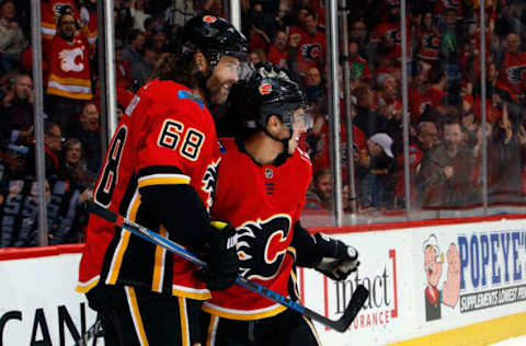 CALGARY, AB – NOVEMBER 9: Jaromir Jagr #68 and Johnny Gaudreau #13 of the Calgary Flames celebrate a goal against the Detroit Red Wings during an NHL game on November 9, 2017 at the Scotiabank Saddledome in Calgary, Alberta, Canada. (Photo by Gerry Thomas/NHLI via Getty Images)