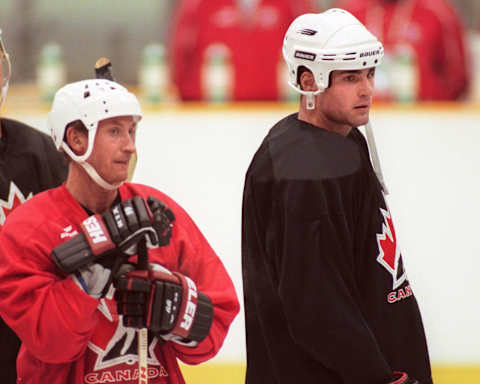 Canadian Olympic hockey team captain Eric Lindros (R) and Wayne Gretzky (L) stand side by side during the Canadians’ first practice session in Nagano, Japan February 10, 1998. (Photo by KAZUHIRO NOGI/AFP via Getty Images)