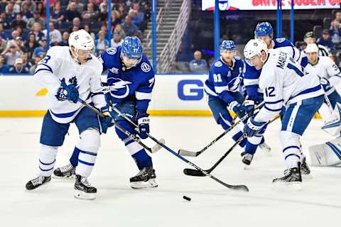 TAMPA, FL – MARCH 20: Tampa Bay Lightning defender Victor Hedman (77) and Toronto Maple Leafs left wing Andreas Johnsson (18) battle for a puck as Toronto Maple Leafs center Patrick Marleau (12) looks on during the third period of an NHL game between the Toronto Maple Leafs and the Tampa Bay Lightning on March 20, 2018, at Amalie Arena in Tampa, FL. The Lightning scored three goals in the third period to defeat the Maple Leafs 4-3. (Photo by Roy K. Miller/Icon Sportswire via Getty Images)