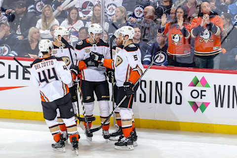 WINNIPEG, MB – FEBRUARY 2: Michael Del Zotto #44, Nick Ritchie #37, Derek Grant #38, Daniel Sprong #11 and Korbinian Holzer #5 of the Anaheim Ducks celebrate a second period goal against the Winnipeg Jets at the Bell MTS Place on February 2, 2019 in Winnipeg, Manitoba, Canada. (Photo by Jonathan Kozub/NHLI via Getty Images)