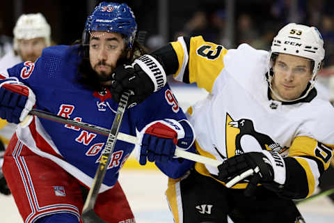 Mar 25, 2022; New York, New York, USA; New York Rangers center Mika Zibanejad (93) and Pittsburgh Penguins center Teddy Blueger (53) fight for position during the first period at Madison Square Garden. Mandatory Credit: Brad Penner-USA TODAY Sports