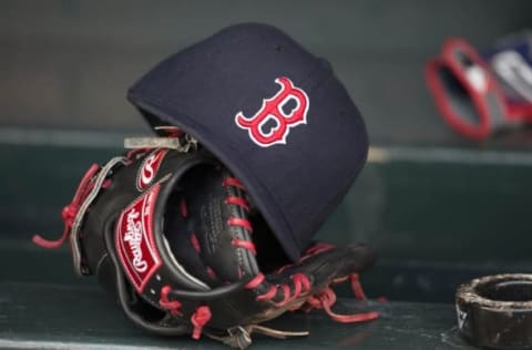 May 14, 2014; Minneapolis, MN, USA; A general view of a glove and Boston Red Sox hat in the dugout prior to a game between the Boston Red Sox and Minnesota Twins at Target Field. Mandatory Credit: Jesse Johnson-USA TODAY Sports