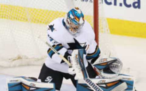 NHL Power Rankings: San Jose Sharks goalie Aaron Dell (30) makes a save during the second period against the Winnipeg Jets at MTS Centre. Mandatory Credit: Bruce Fedyck-USA TODAY Sports