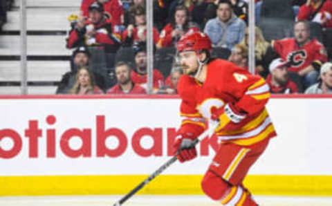 CALGARY, CANADA – APRIL 2: Rasmus Andersson #4 of the Calgary Flames in action against the Anaheim Ducks during an NHL game at Scotiabank Saddledome on April 2, 2023 in Calgary, Alberta, Canada. The Flames defeated the Ducks 5-4. (Photo by Derek Leung/Getty Images)