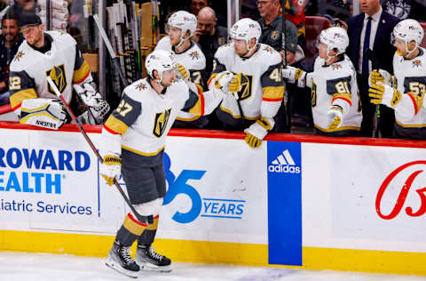 Mar 7, 2023; Sunrise, Florida, USA; Vegas Golden Knights defenseman Shea Theodore (27) celebrates with teammates after scoring during the second period against the Florida Panthers at FLA Live Arena. Mandatory Credit: Sam Navarro-USA TODAY Sports