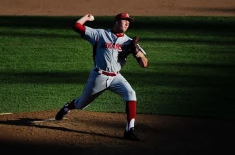 Jun 15, 2015; Omaha, NE, USA; Arkansas Razorbacks pitcher Zachk Jackson (32) pitches against the Miami Hurricanes in the seventh inning in the 2015 College World Series at TD Ameritrade Park. Miami defeated Arkansas 4-3. Mandatory Credit: Steven Branscombe-USA TODAY Sports