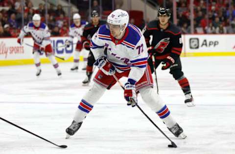 RALEIGH, NORTH CAROLINA – FEBRUARY 11: Filip Chytil #72 of the New York Rangers attempts a shot during the third period of the game against the Carolina Hurricanes at PNC Arena on February 11, 2023 in Raleigh, North Carolina. (Photo by Jared C. Tilton/Getty Images)