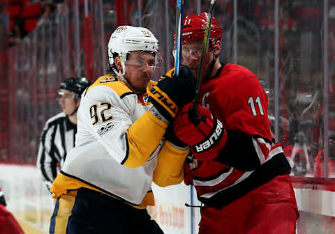 RALEIGH, NC – NOVEMBER 26: Ryan Johansen #92 of the Nashville Predators connects with Jordan Staal #11 of the Carolina Hurricanes during an NHL game on November 26, 2017 at PNC Arena in Raleigh, North Carolina. (Photo by Gregg Forwerck/NHLI via Getty Images)