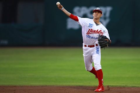 MEXICO CITY, MEXICO – AUGUST 04: Ramon Urias of Diablos Rojos throws the ball to first base during the match between Vaqueros Laguna and Diablos Rojos as part of the Liga Mexicana de Beisbol 2017 at Fray Nano Stadium on August 04, 2017 in Mexico City, Mexico. (Photo by Hector Vivas/LatinContent/Getty Images)