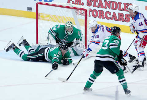 DALLAS, TEXAS – MARCH 05: Pavel Buchnevich #89 of the New York Rangers controls the puck against Ben Bishop #30 of the Dallas Stars and Brett Ritchie #25 of the Dallas Stars in the third period at American Airlines Center on March 05, 2019 in Dallas, Texas. (Photo by Tom Pennington/Getty Images)