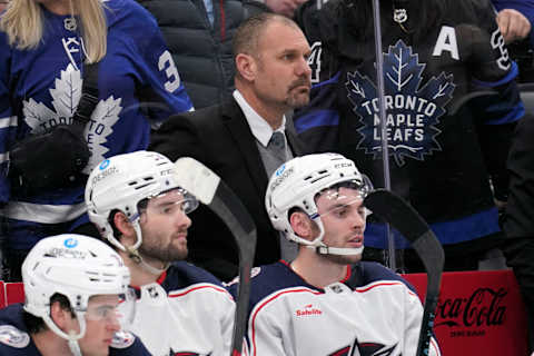 Apr 4, 2023; Toronto, Ontario, CAN; Columbus Blue Jackets head coach Brad Larsen watches the action against the Toronto Maple Leafs during the third period at Scotiabank Arena. Mandatory Credit: John E. Sokolowski-USA TODAY Sports