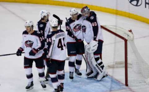 Oct 23, 2022; New York, New York, USA; Columbus Blue Jackets right wing Yegor Chinakhov (59) celebrates with Columbus Blue Jackets goaltender Daniil Tarasov (40) after defeating the New York Rangers at Madison Square Garden. Mandatory Credit: Jessica Alcheh-USA TODAY Sports