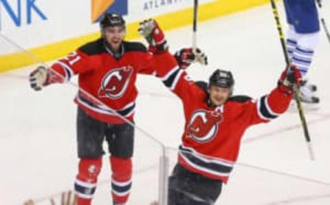 Apr 9, 2016; Newark, NJ, USA; New Jersey Devils left wing Patrik Elias (26) celebrates his goal against the Toronto Maple Leafs during the third period at Prudential Center. The Devils defeated the Maple Leafs 5-1. Mandatory Credit: Ed Mulholland-USA TODAY Sports