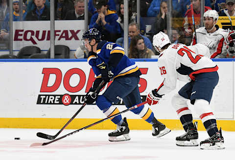 ST. LOUIS, MO. – JANUARY 03: St. Louis Blues defenseman Vince Dunn (29) controls the puck ahead of Washington Capitals center Nic Dowd (26) during an NHL game between the Washington Capitals and the St. Louis Blues on January 03, 2019, at Enterprise Center, St. Louis, MO. (Photo by Keith Gillett/Icon Sportswire via Getty Images)