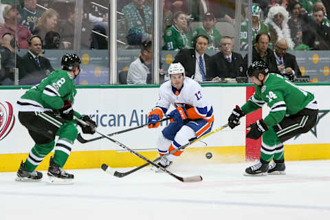 DALLAS, TX – NOVEMBER 10: New York Islanders Center Mathew Barzal (13) plays a puck between Dallas Stars Left Wing Jamie Benn (14) and Defenceman Dan Hamhuis (2) during the NHL hockey game between the New York Islanders and Dallas Stars on November 10, 2017 at American Airlines Center in Dallas, TX. (Photo by Andrew Dieb/Icon Sportswire via Getty Images)