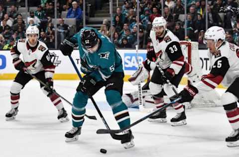 SAN JOSE, CA – FEBRUARY 02: Lukas Radil #52 of the San Jose Sharks battles for the puck against Nick Cousins #25, Alex Goligoski #33 and Jordan Oesterie #82 of the Arizona Coyotes at SAP Center on February 2, 2018 in San Jose, California (Photo by Brandon Magnus/NHLI via Getty Images)