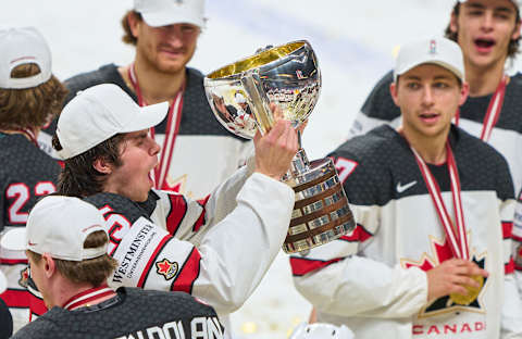 RIGA, LATVIA – JUNE 06: Owen Power #25 of celebrates with the trophy after the 2021 IIHF Ice Hockey World Championship Gold Medal Game between Canada and Finland at Arena Riga on June 6, 2021 in Riga, Latvia. Canada defeated Finland 3-2. (Photo by EyesWideOpen/Getty Images)