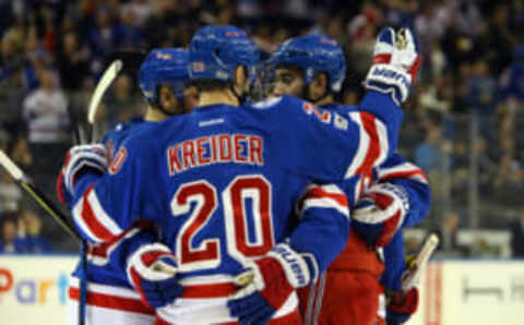 Apr 2, 2017; New York, NY, USA; New York Rangers left wing Chris Kreider (20) celebrates with center Mika Zibanejad (93) after his game tying goal against the Philadelphia Flyers during the second period at Madison Square Garden. Mandatory Credit: Danny Wild-USA TODAY Sports