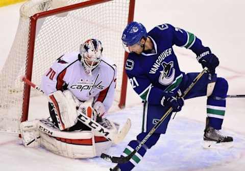 Oct 22, 2015; Vancouver, British Columbia, CAN; Vancouver Canucks forward Brandon Sutter (21) screens Washington Capitals goaltender Braden Holtby (70) during the third period at Rogers Arena. The Washington Capitals won 3-2. Mandatory Credit: Anne-Marie Sorvin-USA TODAY Sports