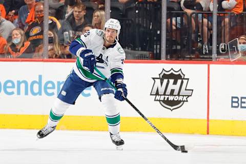 PHILADELPHIA, PENNSYLVANIA – OCTOBER 15: Oliver Ekman-Larsson #23 of the Vancouver Canucks looks to pass during the second period against the Philadelphia Flyers at Wells Fargo Center on October 15, 2021 in Philadelphia, Pennsylvania. (Photo by Tim Nwachukwu/Getty Images)