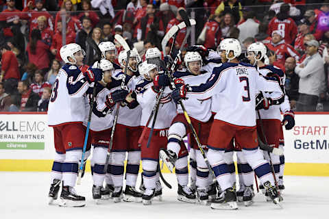 WASHINGTON, DC – JANUARY 12: Artemi Panarin #9 of the Columbus Blue Jackets celebrates with his teammates after scoring the game winning goal in overtime to defeat the Washington Capitals 2-1 at Capital One Arena on January 12, 2019 in Washington, DC. (Photo by Patrick McDermott/NHLI via Getty Images)