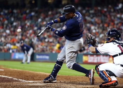 Jul 4, 2016; Houston, TX, USA; Seattle Mariners second baseman Robinson Cano (22) hits a single during the seventh inning against the Houston Astros at Minute Maid Park. Mandatory Credit: Troy Taormina-USA TODAY Sports