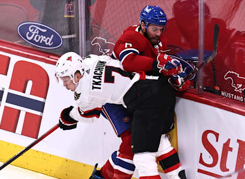 Apr 3, 2021; Montreal, Quebec, CAN; Montreal Canadiens defenseman Shea Weber (6) is checked into the boards by Ottawa Senators left wing Brady Tkachuk (7) during the first period at Bell Centre. Mandatory Credit: Jean-Yves Ahern-USA TODAY Sports