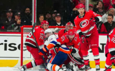 Apr 19, 2023; Raleigh, North Carolina, USA;i New York Islanders center Brock Nelson (29) Carolina Hurricanes goaltender Antti Raanta (32) defenseman Brady Skjei (76) right wing Stefan Noesen (23) and defenseman Brett Pesce (22) watch the play during the first period in game two of the first round of the 2023 Stanley Cup Playoffs at PNC Arena. Mandatory Credit: James Guillory-USA TODAY Sports