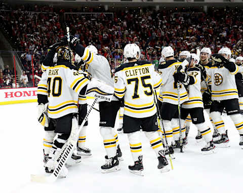 RALEIGH, NC – MAY 16: Tuukka Rask #40 of the Boston Bruins celebrates a victory with teammates in Game Four of the Eastern Conference Third Round against the Carolina Hurricanes during the 2019 NHL Stanley Cup Playoffs on May 16, 2019 at PNC Arena in Raleigh, North Carolina. (Photo by Gregg Forwerck/NHLI via Getty Images)