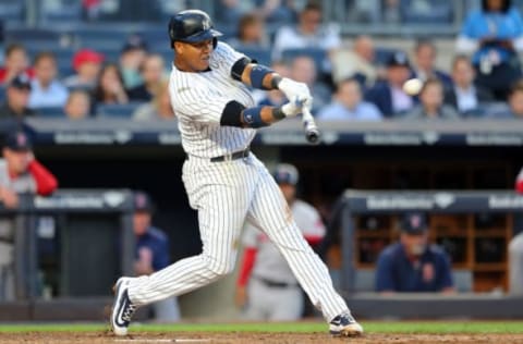 Jun 7, 2017; Bronx, NY, USA; New York Yankees second baseman Starlin Castro (14) hits a triple against the Boston Red Sox during the fourth inning at Yankee Stadium. Mandatory Credit: Brad Penner-USA TODAY Sports