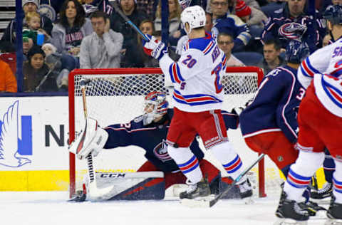 COLUMBUS, OH – JANUARY 13: Chris Kreider #20 of the New York Rangers sets a screen as Sergei Bobrovsky #72 of the Columbus Blue Jackets makes a save during the second period on January 13, 2019 at Nationwide Arena in Columbus, Ohio. (Photo by Kirk Irwin/Getty Images)