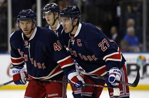 NHL Power Rankings: New York Rangers defenseman Ryan McDonagh (27) talks with right wing Michael Grabner (40) during a break in play against the Carolina Hurricanes during the third period at Madison Square Garden. Mandatory Credit: Adam Hunger-USA TODAY Sports